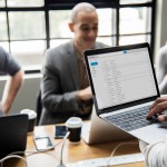 Man checking his email on a laptop